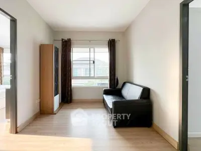 Bright living room with modern sofa and large window view