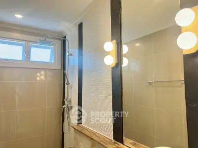 Modern bathroom with elegant lighting and spacious shower area