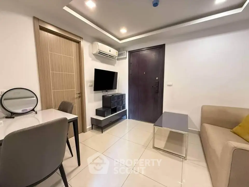 Modern living room with sleek furniture and air conditioning in a stylish apartment.