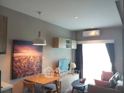 Modern living room with stylish decor and cityscape artwork, featuring cozy seating and ambient lighting.