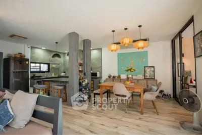 Modern open-plan living and dining area with stylish decor and natural light.