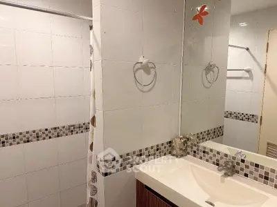 Modern bathroom with stylish tiles and sleek sink design