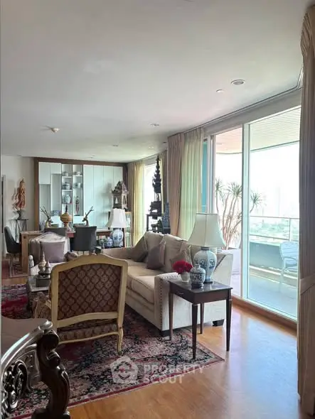 Elegant living room with large balcony and stylish decor