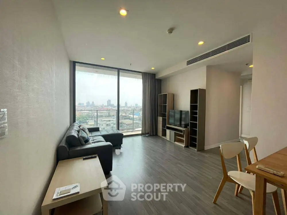 Spacious modern living room with city view and stylish furniture