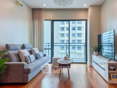 Modern living room with large windows and stylish decor in urban apartment