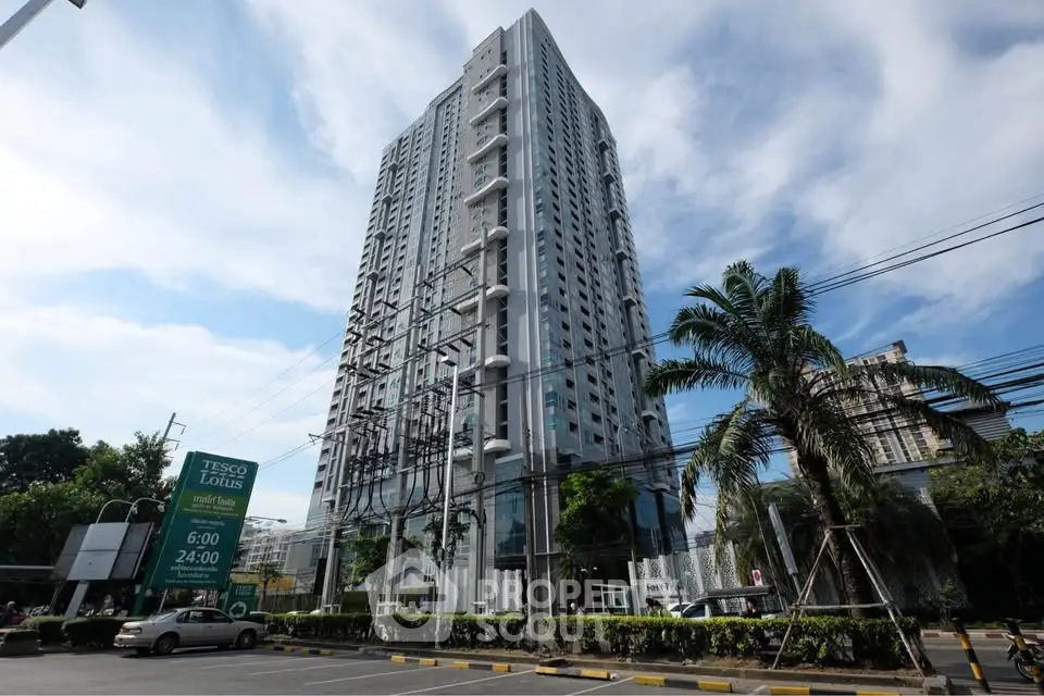 Stunning high-rise building with modern architecture and lush surroundings, perfect for urban living.