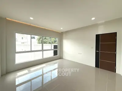 Spacious unfurnished room with large windows and modern tile flooring, perfect for customization.