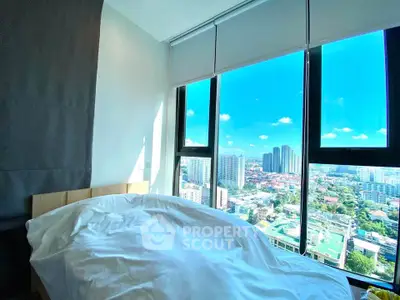 Bright bedroom with stunning city view through large windows