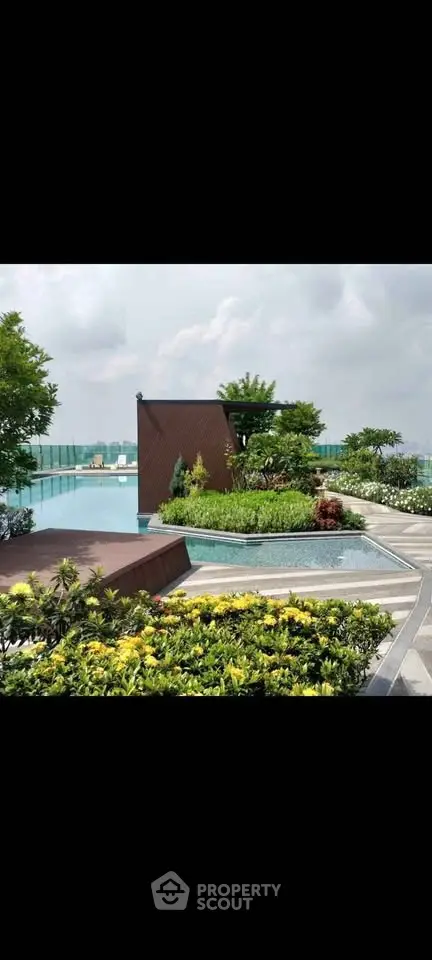 Luxurious rooftop garden with pool offering stunning city views and lush greenery.