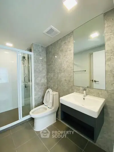 Modern bathroom with sleek shower and stylish sink