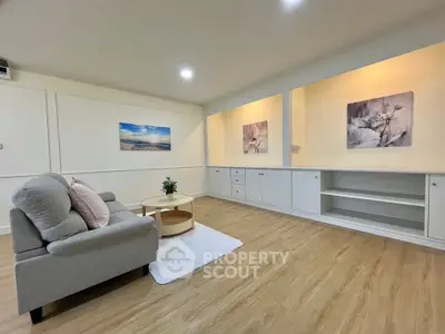 Spacious living room with modern decor and cozy seating area