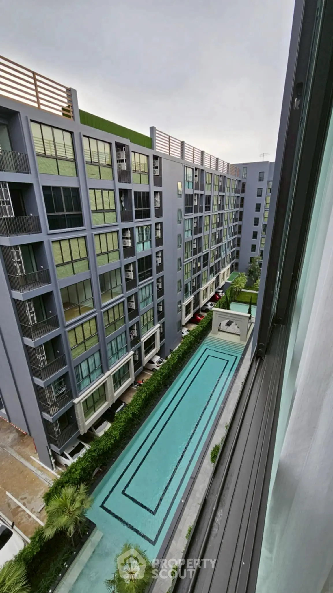 Modern condominium with swimming pool view from upper floor balcony