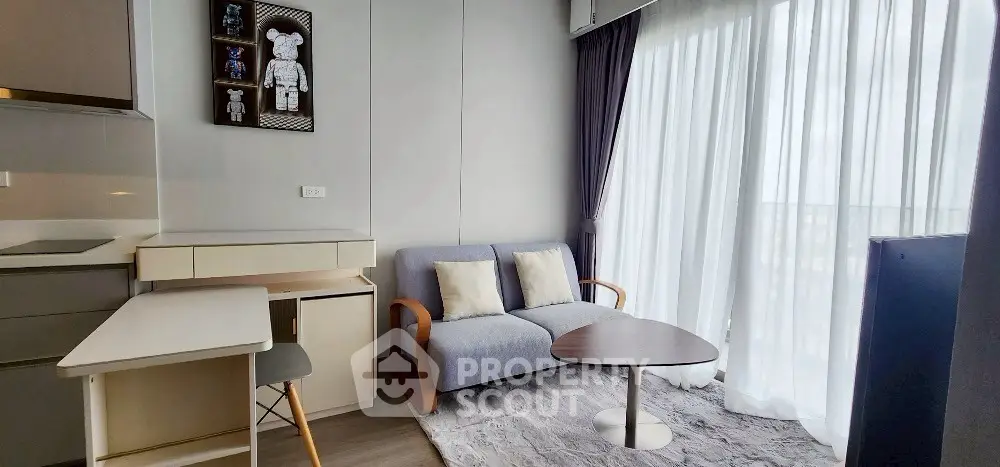 Modern living room with cozy sofa and stylish decor in a bright apartment.