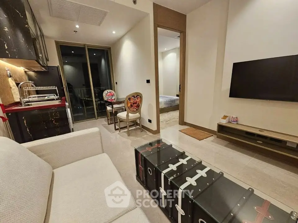 Modern living room with stylish decor and open kitchen layout