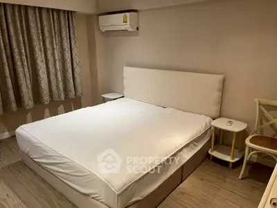 Cozy bedroom with modern air conditioning and elegant decor