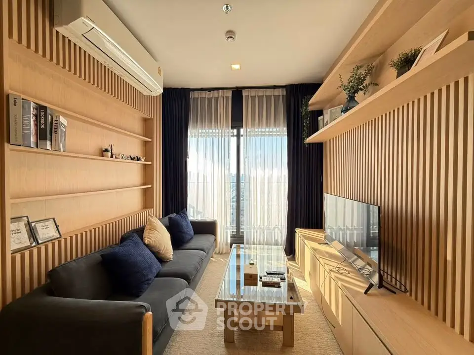 Modern living room with sleek wooden paneling and cozy furnishings