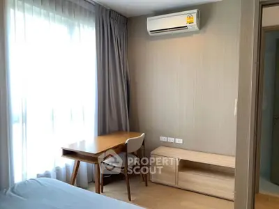 Bright bedroom with modern furniture and air conditioning in a stylish apartment.