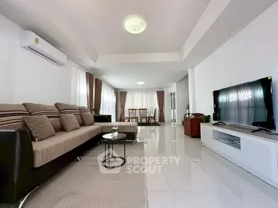 Spacious modern living room with elegant decor and ample natural light