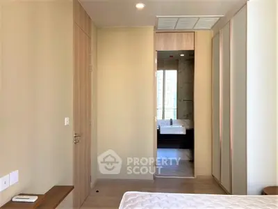 Modern bedroom with ensuite bathroom and sleek design