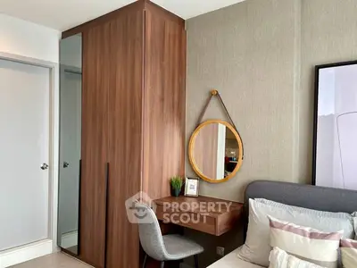 Modern bedroom with stylish wooden wardrobe and cozy study corner