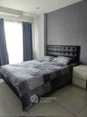 Modern bedroom with stylish decor and natural light