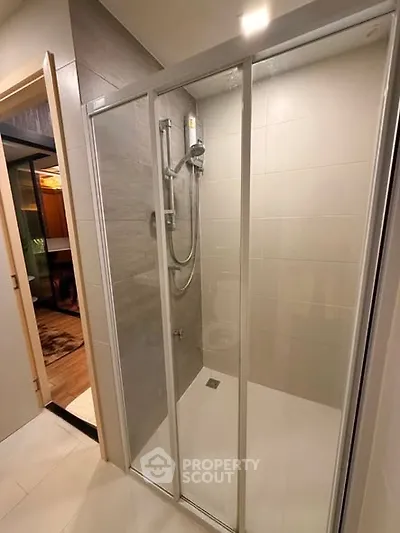 Modern bathroom with glass shower enclosure and sleek design
