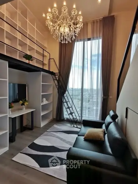 Luxurious loft living room with high ceilings, elegant chandelier, and floor-to-ceiling windows.