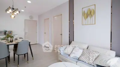 Stylish living room with modern decor and dining area, perfect for contemporary living.