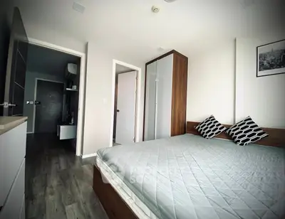 Modern bedroom with stylish decor and ample natural light