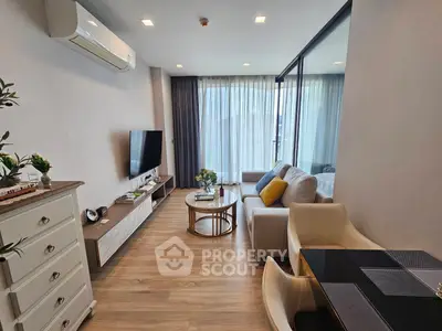 Modern living room with stylish decor and large windows for natural light