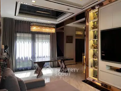 Luxurious living room with modern chandelier and elegant decor