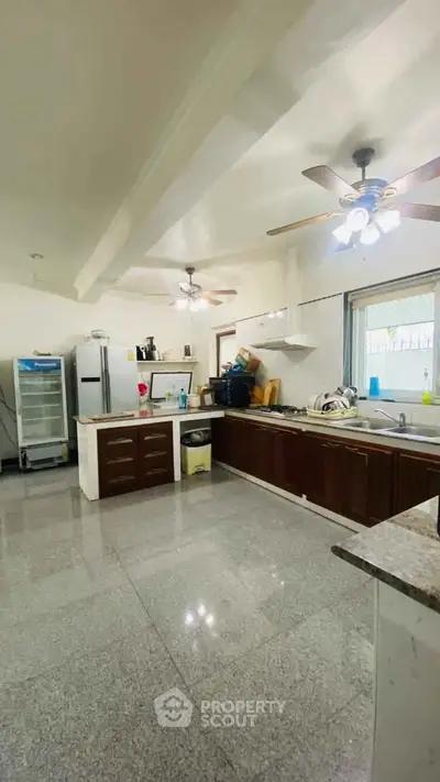 Spacious kitchen with modern appliances and ample counter space