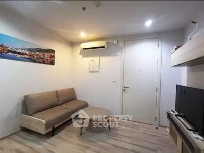 Modern living room with sleek furniture and air conditioning in a cozy apartment.