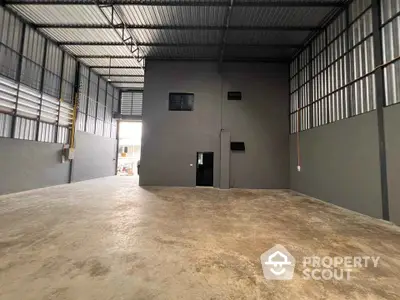 Spacious industrial warehouse with high ceilings and large open floor plan.