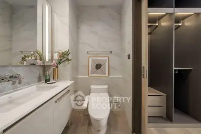 Luxurious bathroom with modern fixtures and elegant walk-in closet