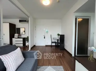 Modern living room with stylish decor and wooden flooring