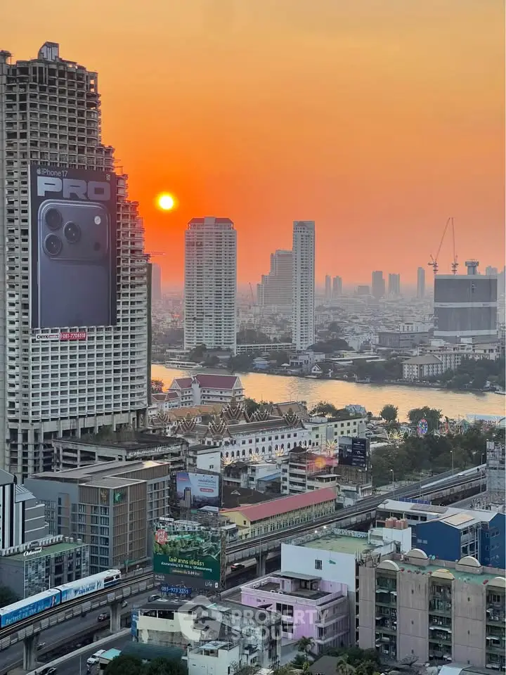 Stunning cityscape view at sunset with high-rise buildings and river.