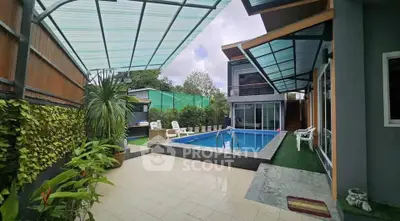 Luxurious modern home with private pool and spacious patio area