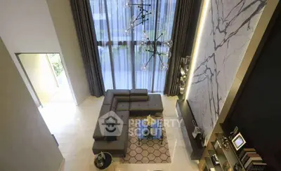 Luxurious modern living room with high ceiling and elegant decor