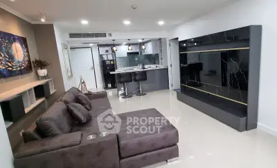 Modern living room with sleek design and open kitchen layout