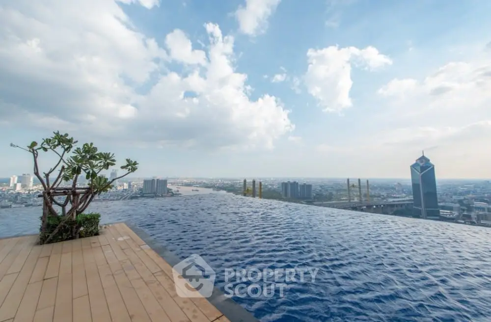 Stunning rooftop infinity pool with panoramic city skyline view