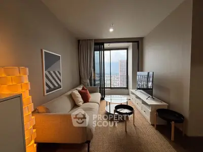 Modern living room with cozy sofa, stylish decor, and city view from large window.