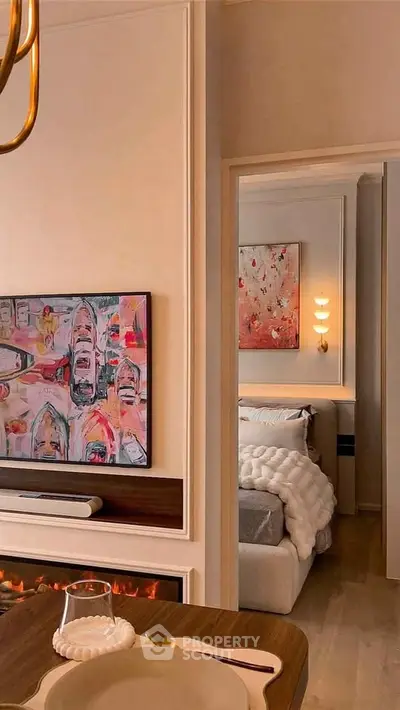 Stylish modern interior with cozy bedroom and elegant decor, featuring warm lighting and contemporary artwork.
