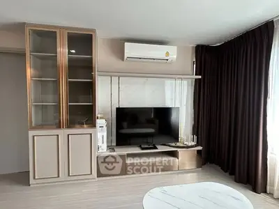 Modern living room with sleek TV unit and elegant curtains