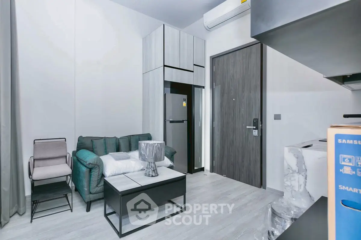 Modern living room with sleek furniture and stylish decor in a contemporary apartment.
