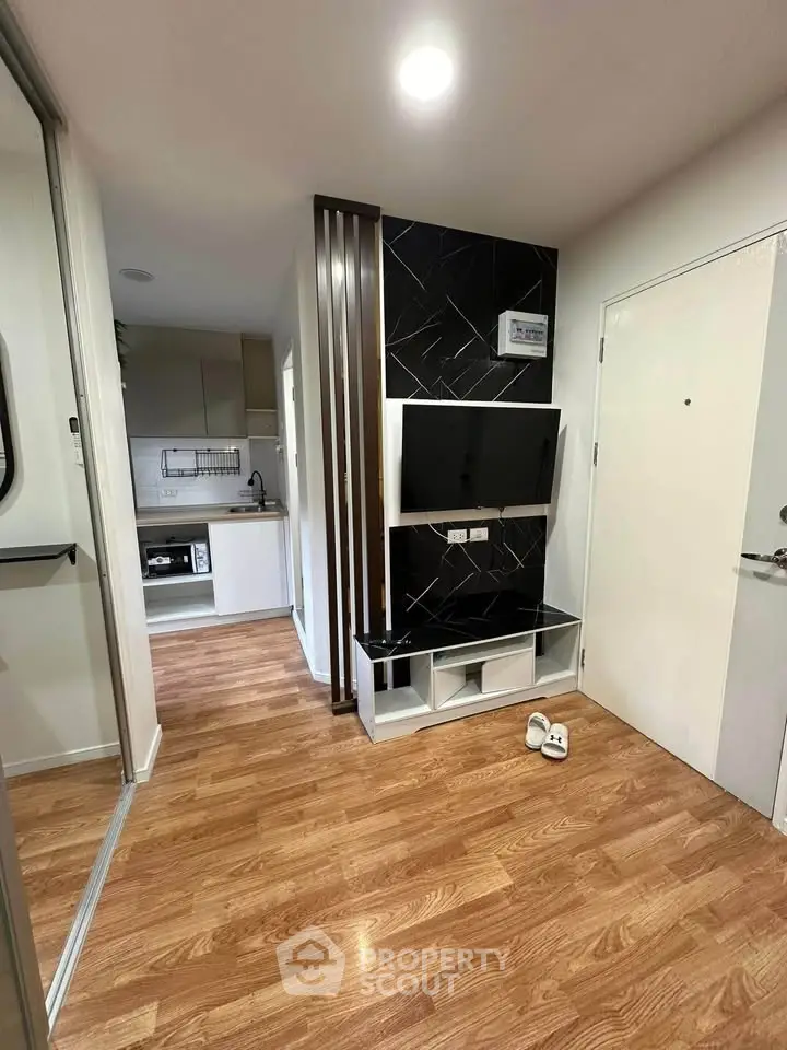 Modern apartment interior with open kitchen and stylish wood flooring