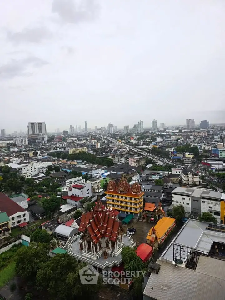 Stunning cityscape view from high-rise building showcasing urban skyline and architectural diversity.