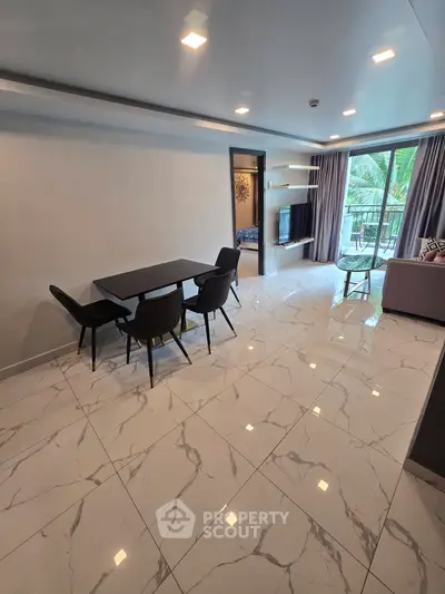 Spacious modern living room with elegant marble flooring and balcony view