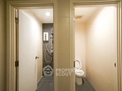 Modern bathroom with separate shower and toilet areas, sleek design.