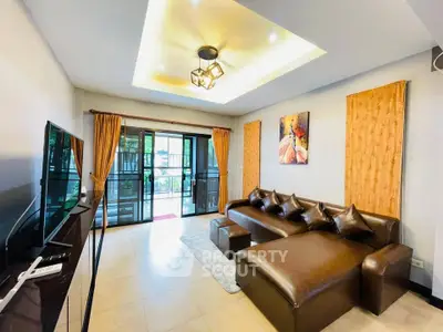 Spacious living room with modern decor and large windows for natural light